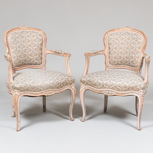 Pair of Louis XV Style Carved Cream Painted Fauteuils en Cabriolet