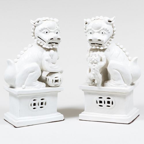 Pair of Chinese White-Glazed Porcelain Figures of Buddhistic Lions