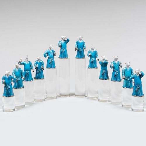 Twelve Chinese Glazed Biscuit Figures of Immortals on Lucite Stands
