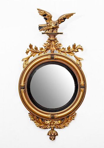 LATE FEDERAL STYLE EBONIZED AND PARCEL-GILT CONVEX MIRROR