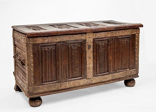 CONTINENTAL METAL-MOUNTED, CARVED AND STAINED OAK LINEN-FOLD BLANKET CHEST