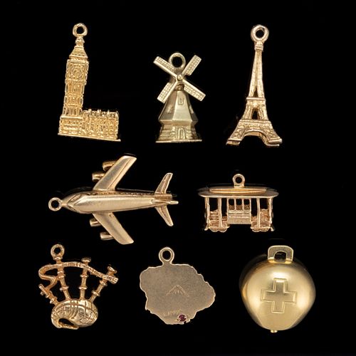 VINTAGE 9K, 14K, AND 18K YELLOW GOLD TRAVEL-THEMED FIGURAL CHARMS, LOT OF EIGHT