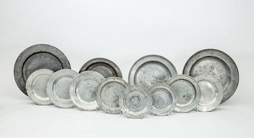 THREE ENGLISH PEWTER CHARGERS; AN UNMARKED PEWTER BASIN; AND EIGHT CONTINENTAL PEWTER GRADUATED PLATES