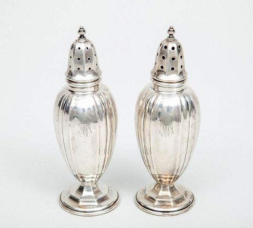 PAIR OF DOMINICK & HAFF WEIGHTED SILVER SALT AND PEPPER CASTERS