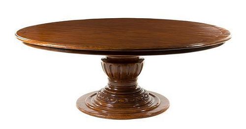 * A Regency Style Mahogany Dining Table Height 28 3/4 x diameter of top 78 inches.