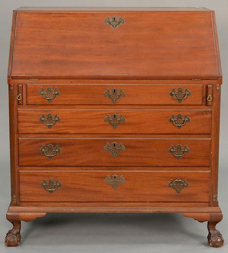 Margolis mahogany Chippendale style desk having slant lid over four graduated drawers flanked by fluted quarter columns, inte
