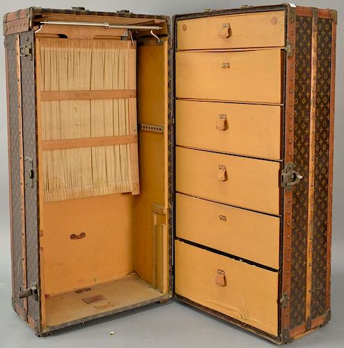 Louis Vuitton steamer trunk having six drawers inside, three hangers along with partition, label inside reads: Arthur Gilmore