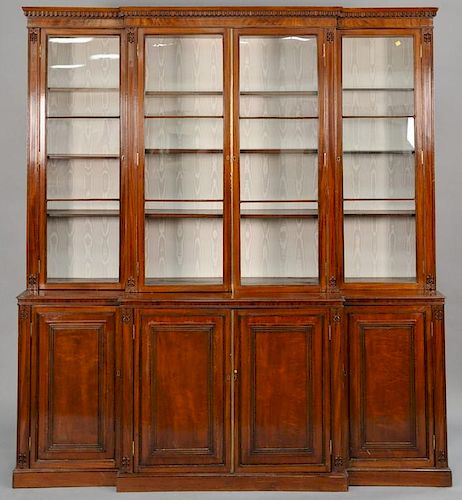 George III mahogany bookcase/cabinet in three parts with four glass doors on lower section with four doors, 19th century.  ht