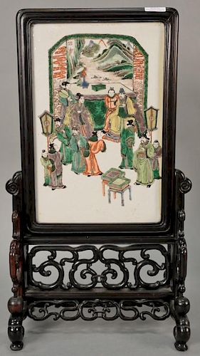 Famille verte porcelain plaque depicting Chinese scholars in hardwood frame on hardwood stand with separately carved balls.  