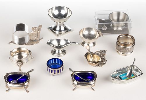 ASSORTED SILVER-PLATED, PEWTER, AND METAL OPEN SALTS, SALT SPOONS, AND NAPKIN RINGS, LOT OF 18