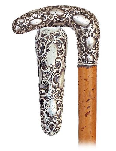 33. Silver Day Dane -Ca. 1890 -L-shaped silver handle modeled with pleasing rounded edges in a rich Baroque taste with dense 