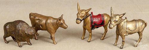 Four cast iron still banks, to include a buffalo, two donkeys, and a cow, tallest - 4 5/8''.