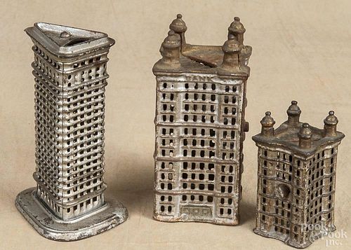 Three cast iron still banks, to include two skyscrapers and a flat iron building, tallest - 5 1/2''.