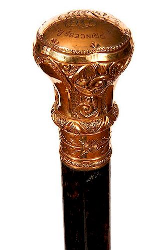 85. Gold Dress Cane- Ca. 1900- A nice gold-filled ornate handle which is signed Simmons, ornate florentine work throughout th