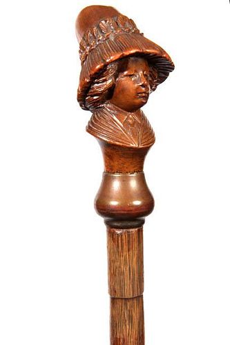 143. Female Portrait Wooden Cane- Ca. 1900- A realistic carving of a lady in a very large attractive hat, faux bamboo partrid