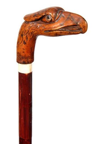 147. American Eagle Folk Cane- Ca. 1880- A carved whimsical hardwood eagle handle with two color class eyes, bone collar, bam