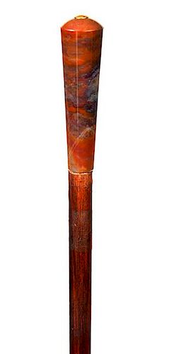 149. Agate Dress Cane- Ca. 1900- An earth tone agate handle with a small gold disk atop, exotic wood shaft and a horn ferrule