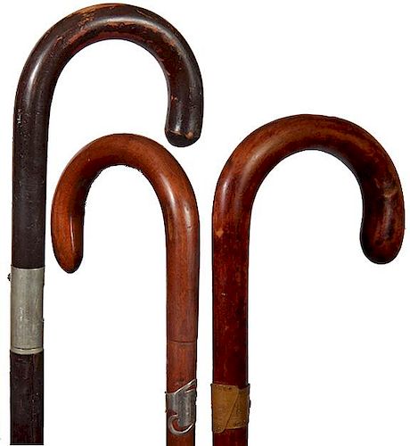 157. Three Crook Handle Canes- Ca. 1930- Chicago 1933 World’s Fair, silver cartouche and a stick. A/L/- 36” $150-250