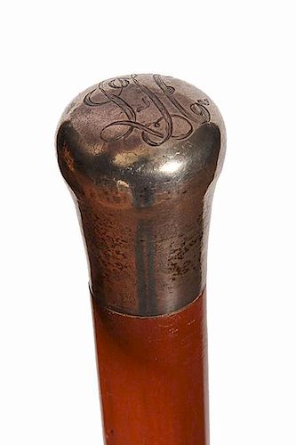 179. Silver Suitcase Cane- Ca. 1900- A plain silver handle with a monogram atop, maple shaft which unscrews in the center whi