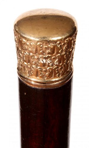 181. Gold Dress Cane- Ca. 1920- A gold-filled art deco dance cane, thick ebony shaft and large silver metal ferrule. H.- 1 ¼