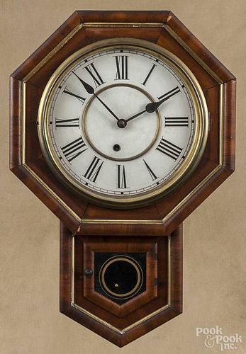 Two mahogany drop octagon wall clocks, ca. 1900, 21'' h. and 21 1/2'' h.