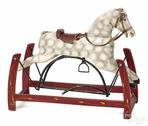 Carved and painted rocking horse, 19th c., on a platform base, 33'' l.