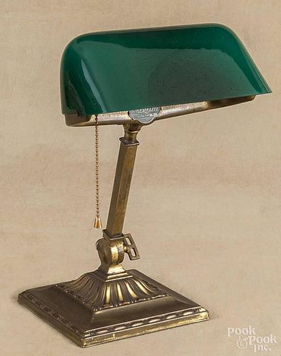 Emeralite cast brass desk lamp, 20th c., with a cased emerald shade, 13 1/2'' h.