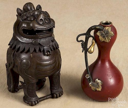 Bronze foo lion box, 20th c., 8 1/2'' h., together with a painted bronze vase, 9'' h.