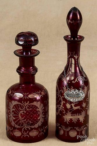 Two red ruby cut to clear decanters, ca. 1900, 13 1/4'' h. and 10 3/4'' h.