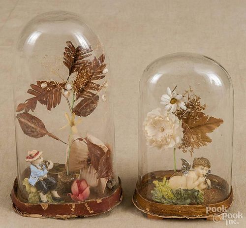 Two Victorian floral wax dioramas under a dome, late 19th c., 9 1/4'' h. and 7'' h.