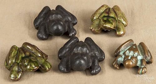 Pair of anatomically correct frog paperweights, 19th c., 3'' l., together with a bronze example