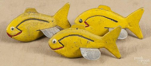 Three painted cast aluminum fish decoys, mid 20th c., marked K. Sletter, Willmar MINN., 4'' l.