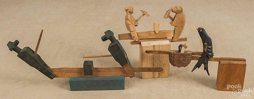 Three carved wood articulated toys, 20th c., to include a mother bird feeding her young