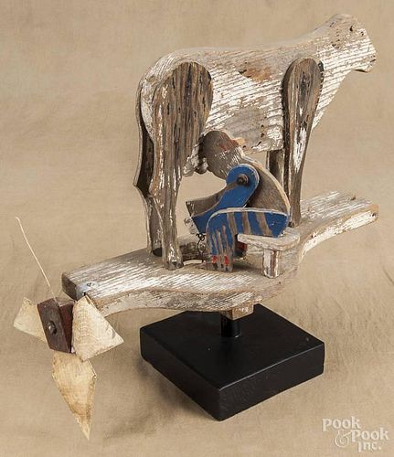 Carved and painted whirligig of a man milking a cow, early 20th c., 15 1/2'' l.