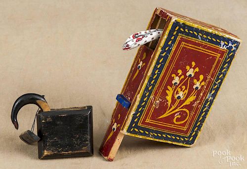 A carved and painted trick snake box, 19th c., 2 1/4'' h., together with a paper covered example