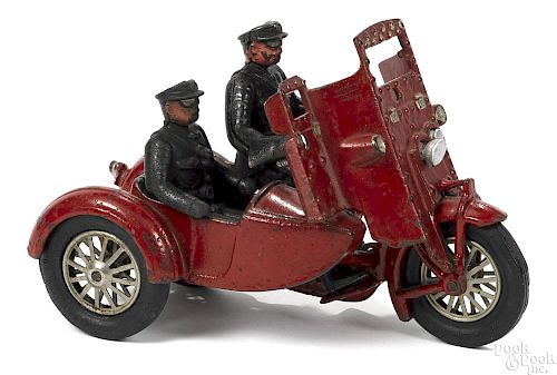 Hubley cast iron Indian motorcycle with a side car, a police driver, and a passenger, 8 1/2'' l.