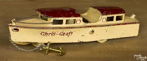 Kilgore cast iron Chris-Craft yacht animated pull toy with a red roof, 11'' l.