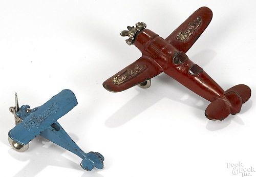 Two small cast iron airplanes, to include a Kilgore Travel Air Mystery