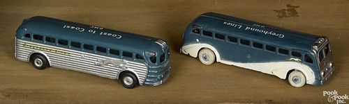 Two Arcade cast iron Greyhound Lines buses, one inscribed Coast to Coast GMC, 9'' l.