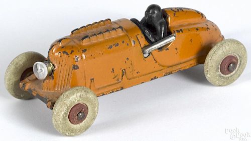 Arcade cast iron bullet no. 9 race car with a nickel-plated driver, a passenger, and side pipes