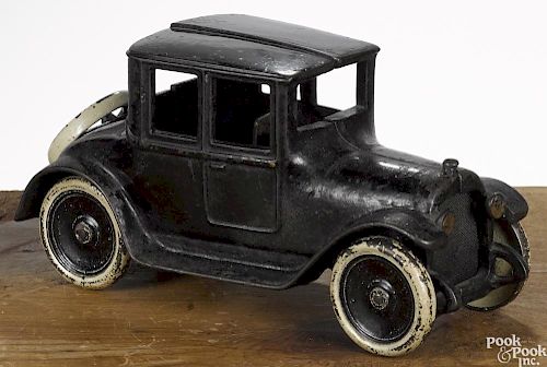 Arcade cast iron Dodge coupe with an embossed 1922 license plate, 8 1/4'' l.