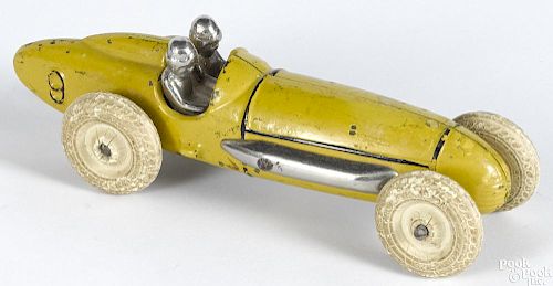 Hubley cast iron racer with a driver and a battery-powered headlight, 6 1/4'' l.