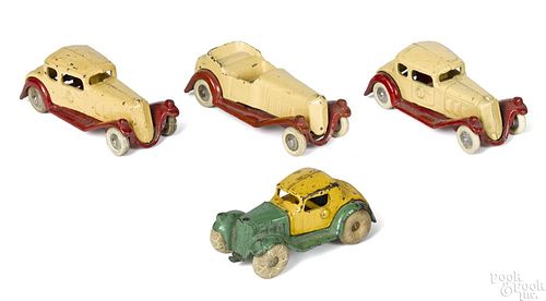 Four small cast iron Hubley cars, largest - 4 1/2'' l.