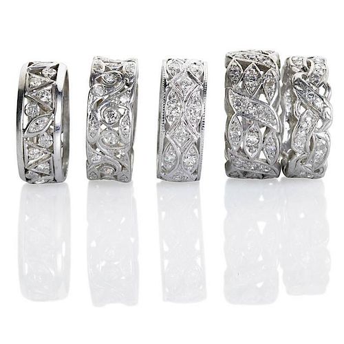 FIVE BROAD PIERCED ETERNITY BANDS WITH DIAMONDS