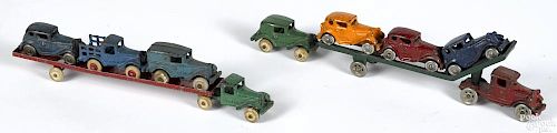 Two cast iron car carriers, to include an A.C. Williams Austin slant bed with three cars