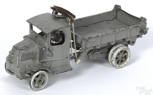 Arcade cast iron Mack T-bar dump truck with a nickel-plated driver and painted spoke wheels