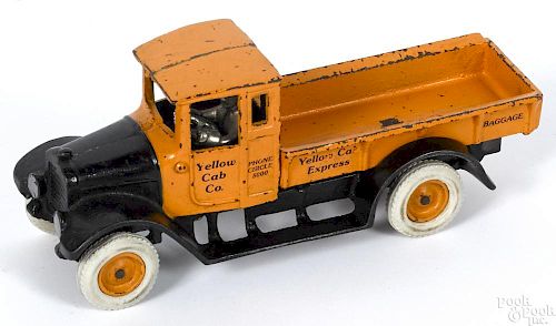 Arcade cast iron Yellow Cab Co. Express Baggage truck with a nickel-plated driver, 10'' l.