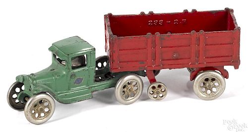 Arcade cast iron tandem truck with stake back trailer with a nickel-plated driver, 11'' l.