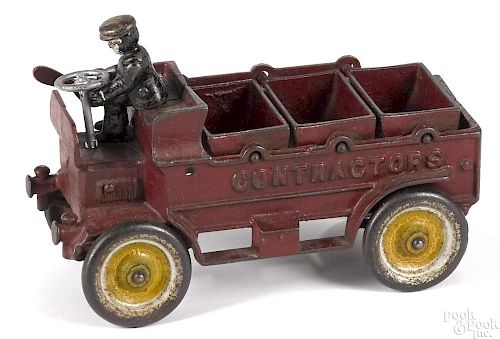 Kenton cast iron Contractors three-bucket dump truck with a painted driver, 8'' l.