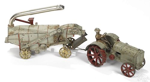 Arcade cast iron McCormick Deering tractor and thresher with a nickel-plated driver, 17 1/2'' l.